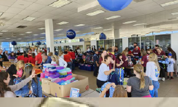 Over 75 volunteers came out to Nemer Ford on August 21 to stuff backpacks with school supplies as part of Tri-County United Way's Kids With Packs program.